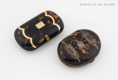 pair of tortoise shell pill cases with gold trim