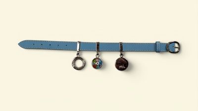 blue leather belt with four charms hanging from it