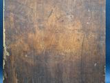 an old wooden easel with a piece of wood sticking out of it