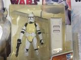 star wars action figures sit on a table next to a remote control