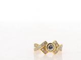 a close up of a gold ring with diamonds on it