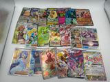 a lot of pokemon cards sitting on a table