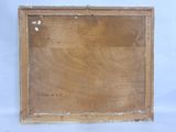 an old picture of a wooden frame hanging on a wall