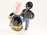 a figurine of a man and a woman holding a hat