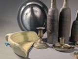 many different types of vases and other items on the table