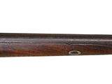 a close up of a rifle on a white background