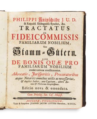 an old book with a black and red title on it