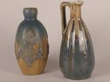 two vases sitting next to each other on a table