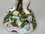 a figurine of a little girl with flowers on it