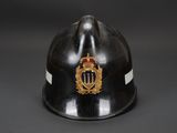 a close up of a fireman ' s helmet on a black background