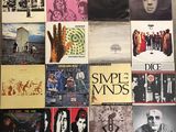 various album covers of various styles and sizes on a table