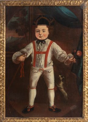 portrait d'un garçon en costume blanc avec des bretelles rouges et un chien
