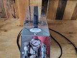 a small machine that is sitting on a wooden table