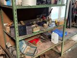 a room with a lot of clutter on the shelves
