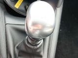 a close up of a car ' s gear lever and shift knob