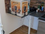 a small kitchen with a sink and a refrigerator
