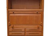 an image of a wooden cabinet with drawers and drawers