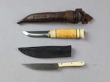several different types of knives are lined up on a table
