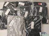 a lot of shirts that are wrapped in plastic