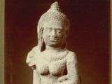 a black and white photo of a statue of a person