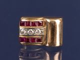 une image représentant une bague en diamant rouge et blanche sur un fond bleu