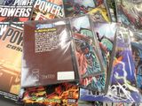 a lot of comic books sitting on a table