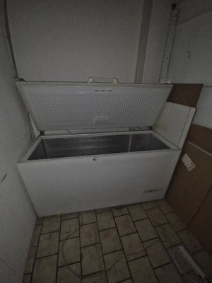 a bathtub in the corner of a bathroom with a tiled floor