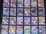 a large collection of pokemon cards are displayed on a table