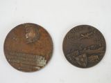 an old coin with a picture of a man on it and another coin with a picture of a man on it