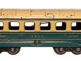 a green and yellow train car on a white background