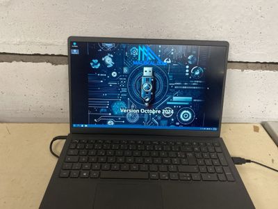 a laptop that is sitting on a table with a mouse