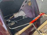 a trunk of a car with a baseball glove in it