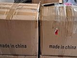 boxes are stacked on top of each other in a warehouse