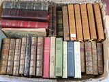a box full of old books sitting on a table