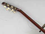 a guitar that is laying on the floor with strings