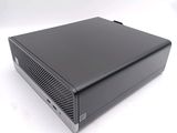 the computer is sitting on a white surface with a white background