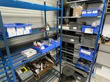 a blue shelf with lots of items on it in a room