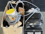 a box with a bunch of tools in it sitting on a pallet