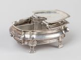 a silver tray with a mirror on top of it