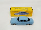 an image of a blue toy car sitting next to a yellow box