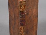 an old book that is sitting on a table