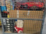a metal cart with several boxes on it in a warehouse