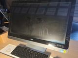 a computer on a desk with a keyboard and mouse