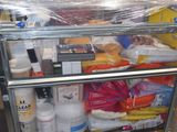 a cart full of supplies sitting on the floor