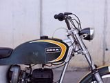 a motorcycle that is parked on the side of the street
