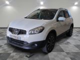 the white nissan qxv is parked on a checkered floor