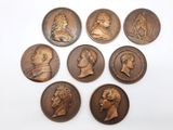 un ensemble de six médaillons en bronze représentant des hommes et des femmes