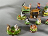 a lot of small figurines that are sitting on a table