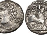 a silver coin with an image of a woman on it