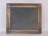 an old wooden frame with a chalkboard in the middle of it